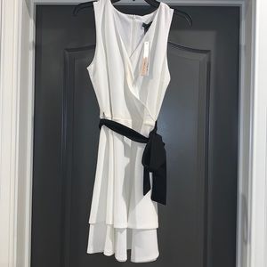 White ruffle dress with black bow